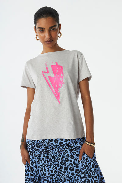 Scamp and Dude Grey T-Shirt with Pink Lightning Bolt Print on Front | Model wearing a grey t-shirt with pink lighting bolt graphic on front with leopard print blue skirt