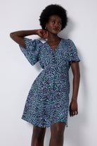 Scamp and Dude Blue with Black Leopard Angel Sleeve Short Tea Dress | Model wearing short tea dress with angel sleeves in a leopard print.