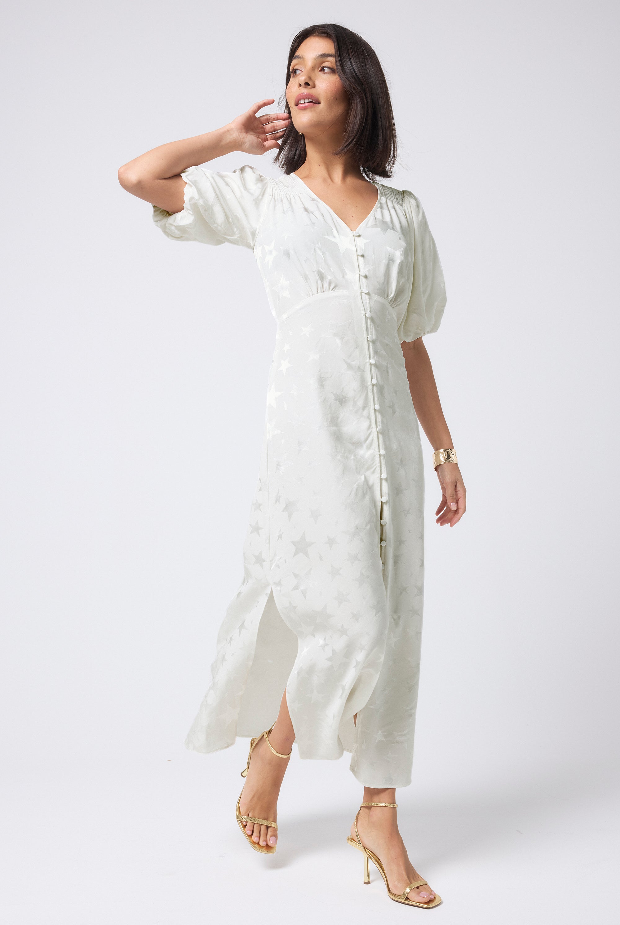 Scamp and Dude White Star and Lightning Bolt Puff Sleeve Midi Tea Dress | Model wearing white midi tea dress with short puff sleeves featuring button front placket and star detail.