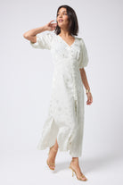 Scamp and Dude White Star and Lightning Bolt Puff Sleeve Midi Tea Dress | Model wearing white midi tea dress with short puff sleeves featuring button front placket and star detail.