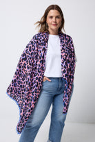 Scamp and Dude Pink with Blue and Black Shadow Leopard Charity Super Scarf | Model wearing a white t-shirt with blue jeans and a pink super scarf with all over blue and black leopard print.