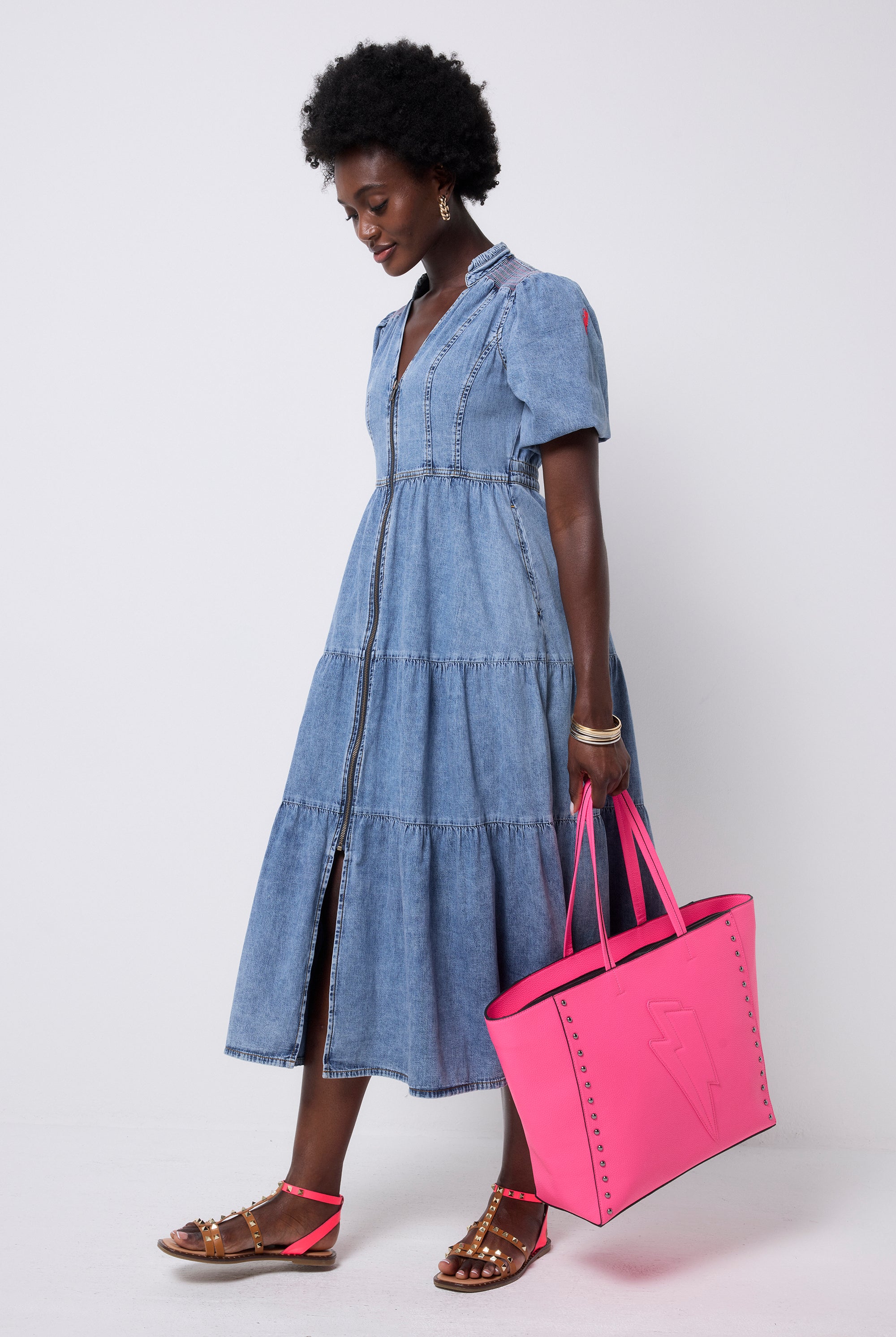 Scamp and Dude Pale Indigo Zip Detail Tiered Midi Denim Dress | Model wearing a pale wash denim dress with a zip through front and tiered skirt.