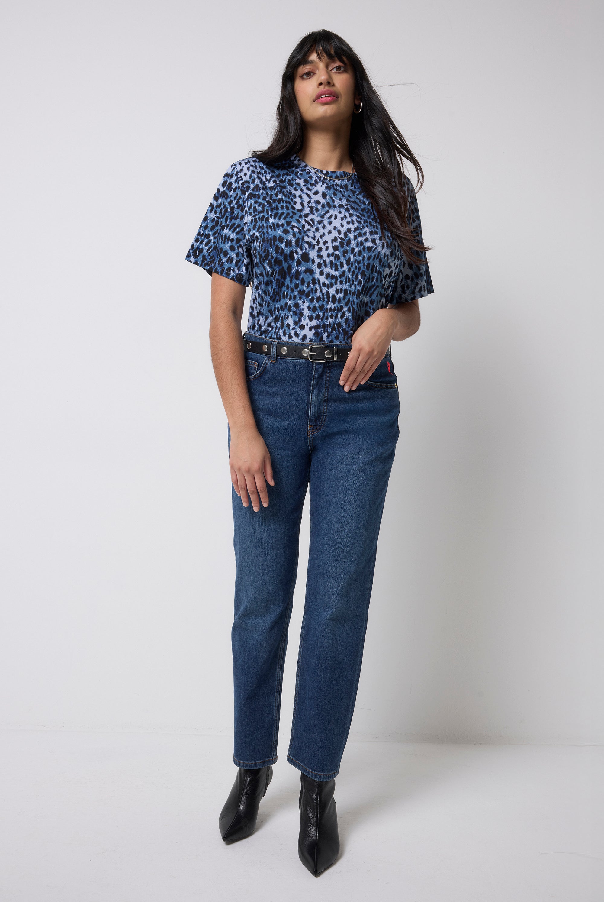 Scamp and Dude Navy with Black Cheetah T-Shirt | Model wearing a pair of dark blue jeans with a navy cheetah print t-shirt.