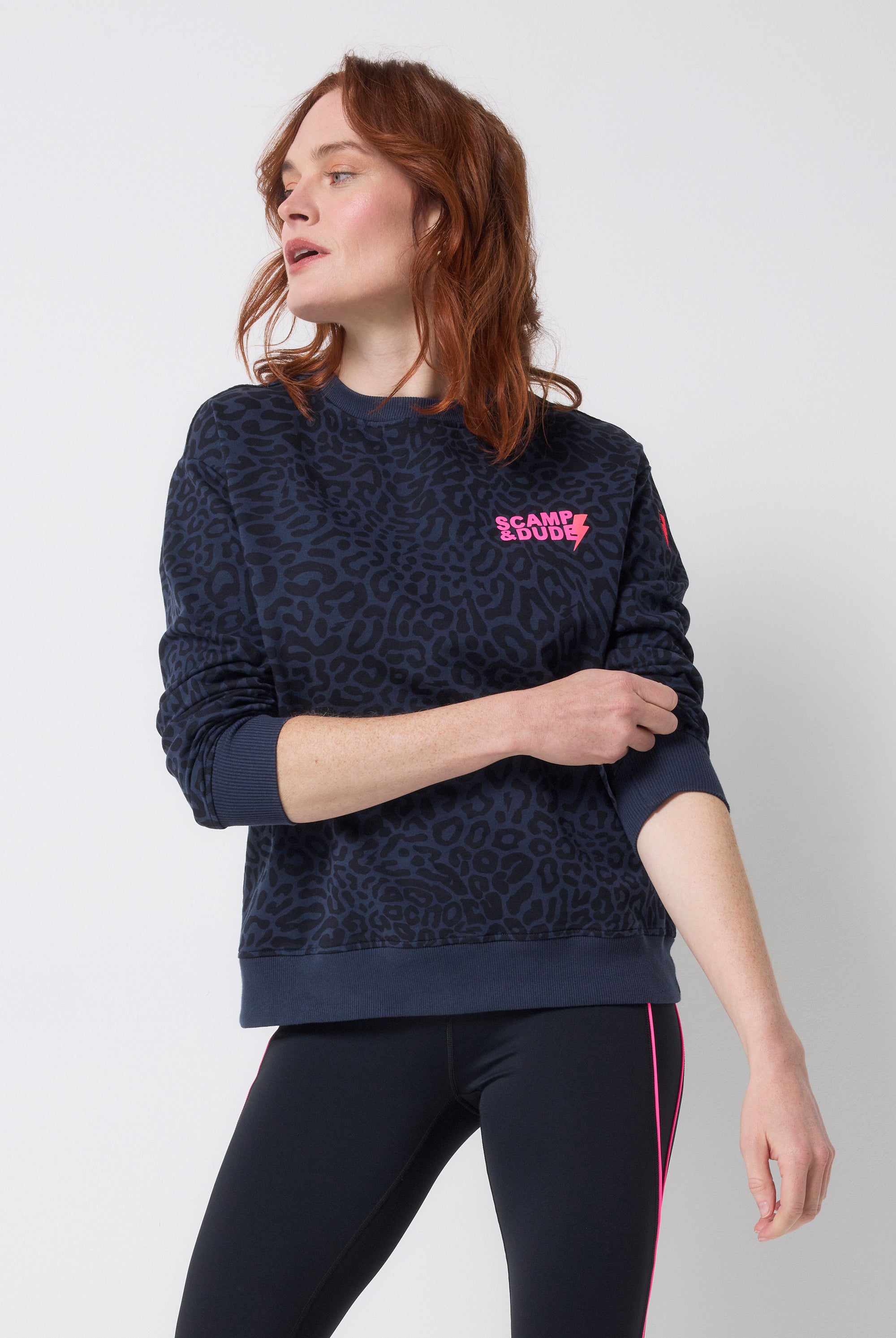 Scamp and Dude Navy with Black Leopard Ray Logo Oversized Sweatshirt | Model wearing a crew neck navy leopard ray print sweatshirt with black leggings.