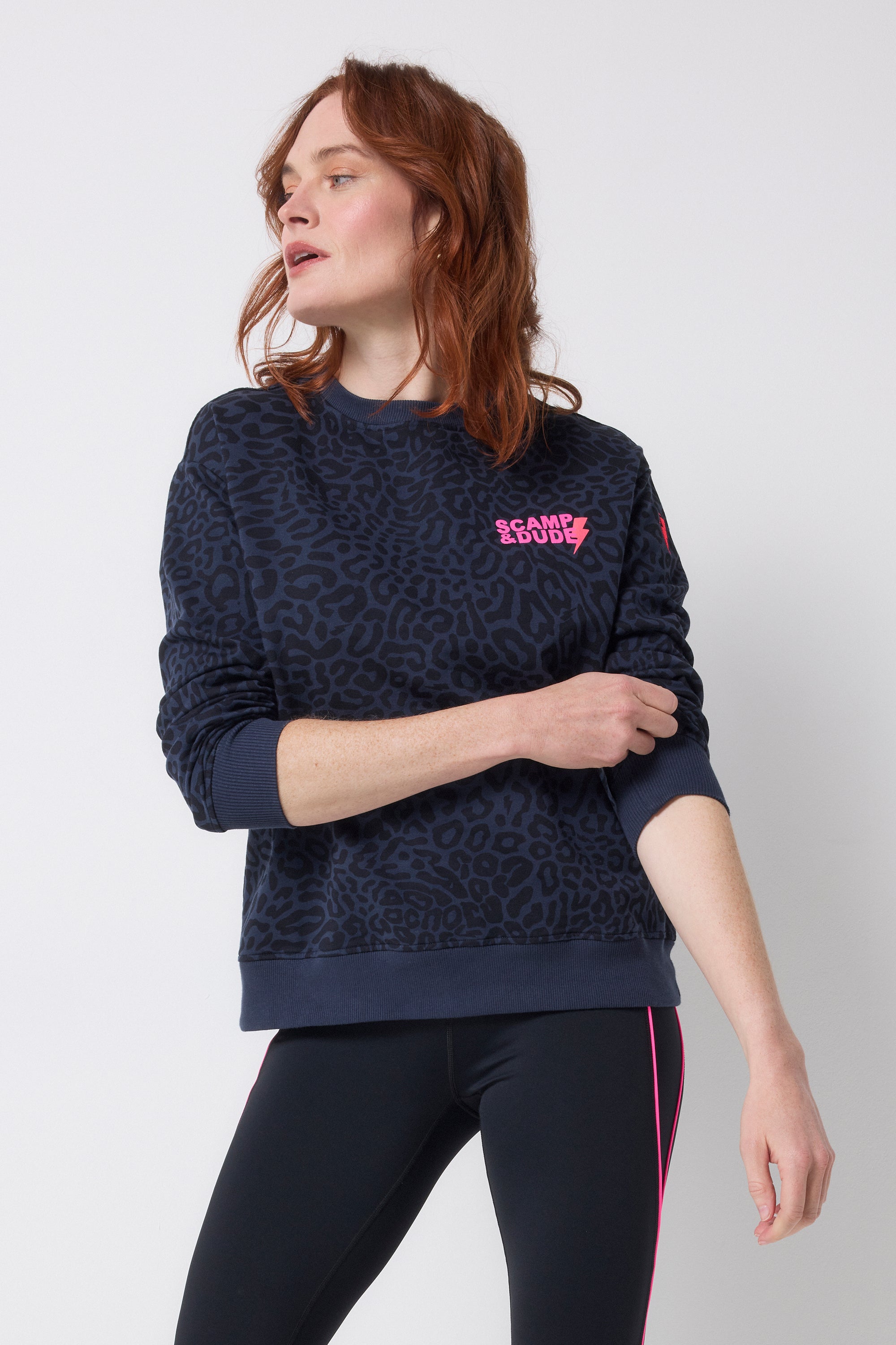 Scamp and Dude Navy with Black Leopard Ray Logo Oversized Sweatshirt | Model wearing a crew neck navy leopard ray print sweatshirt with black leggings.