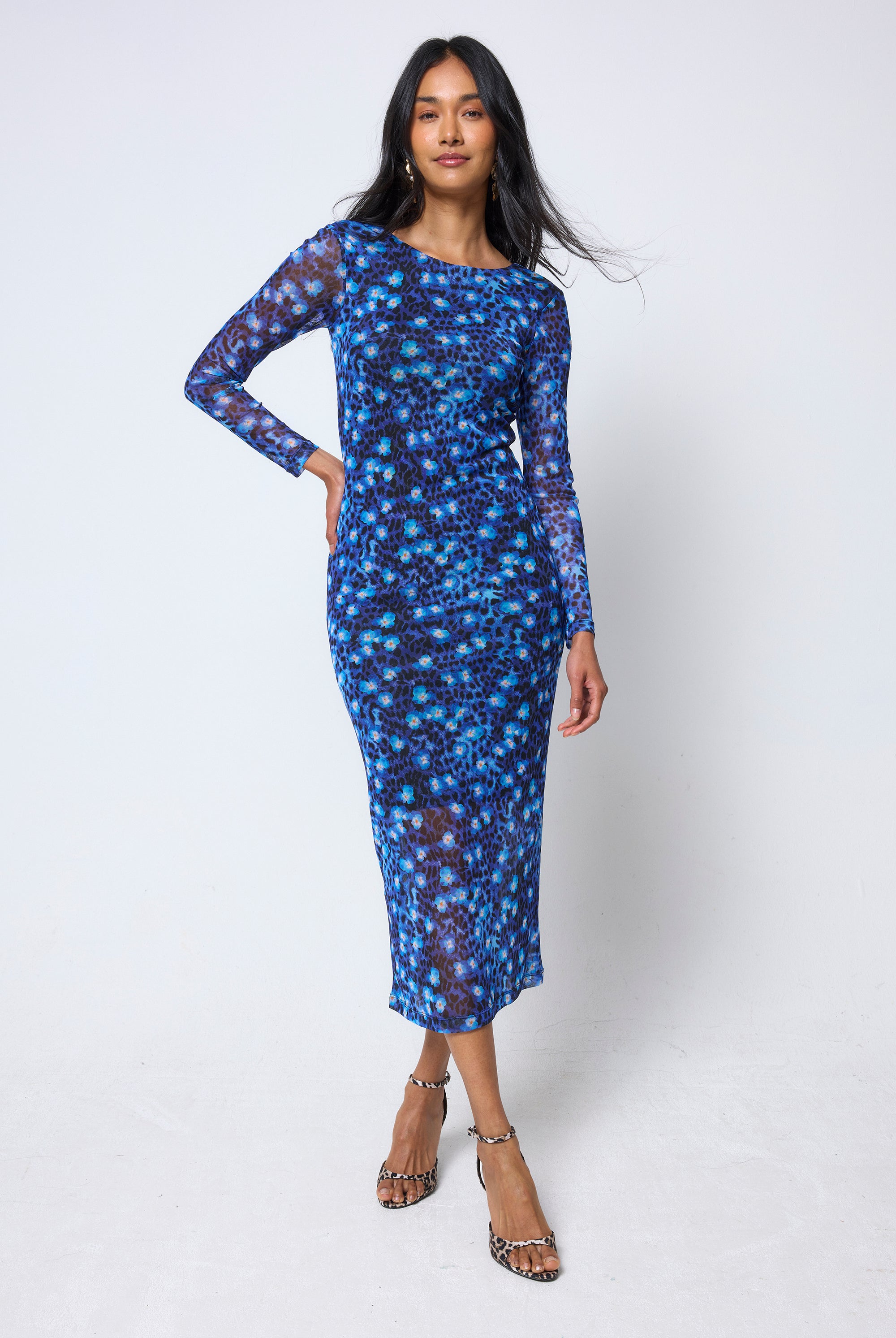Scamp & Dude Navy Paradise Cheetah Mesh Midi Dress | Model wearing a navy paradise cheetah dress on a white background.