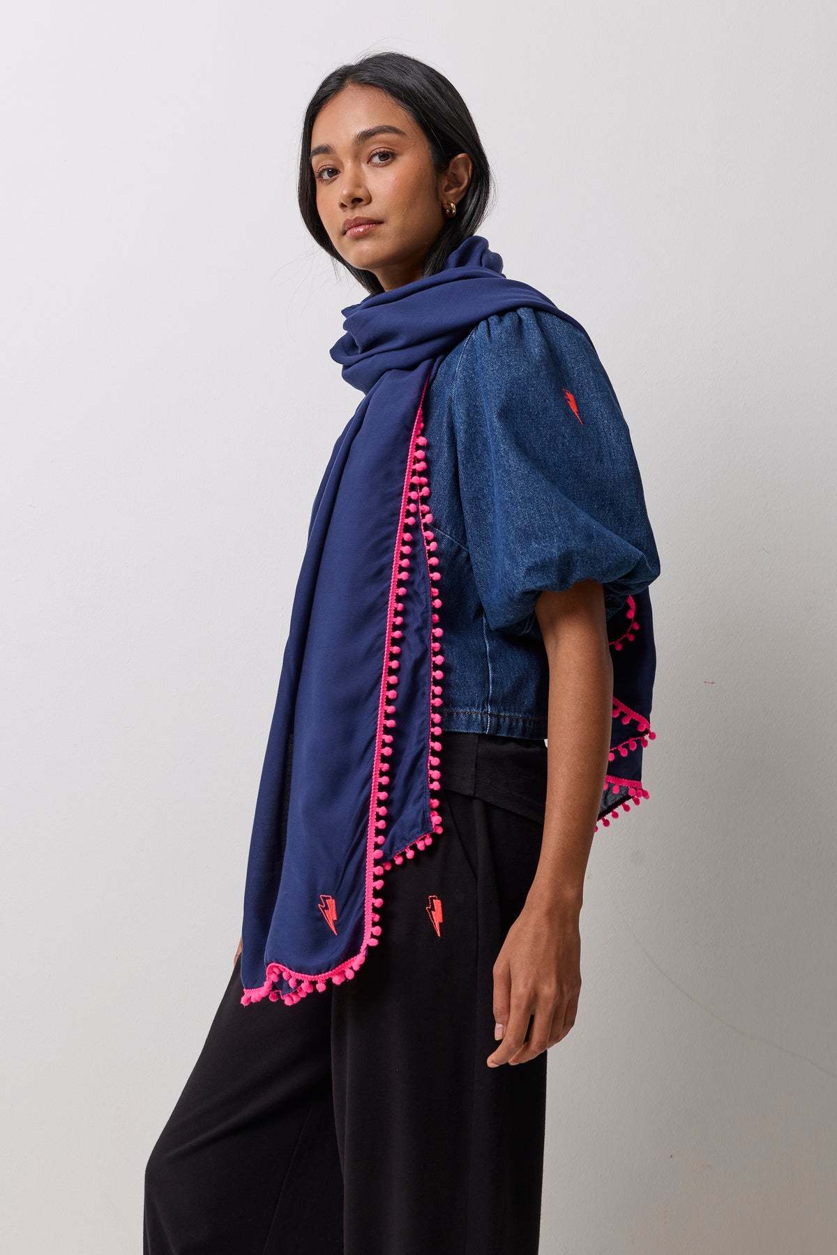 Scamp & Dude Navy Charity Super Scarf | Model wearing a denim top with black joggers and a navy super scarf.