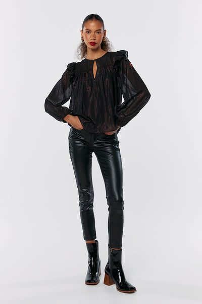 Scamp and Dude Black with Rainbow Lurex Frill Shoulder Blouse | Model wearing metallic black blouse with black leather trousers with heeled black boots