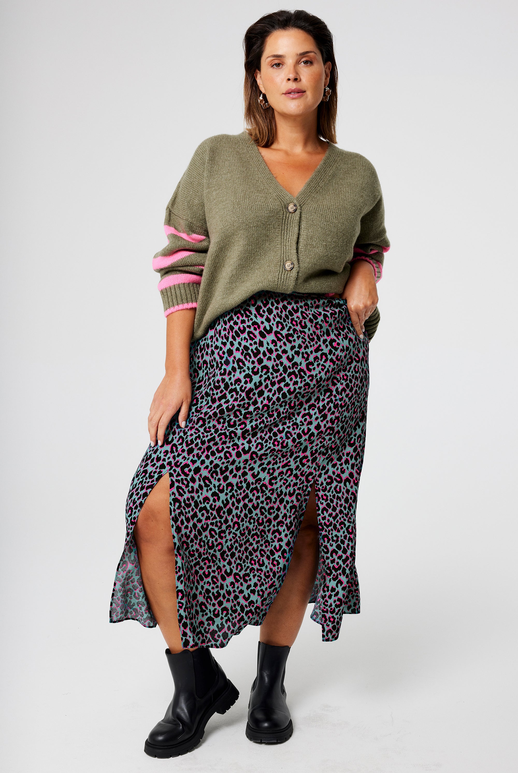 Scamp and Dude Khaki with Pink and Black Small Shadow Leopard Split Front Skirt | Model wearing a green cardigan with khaki midi skirt featuring pink and black small shadow leopard print.