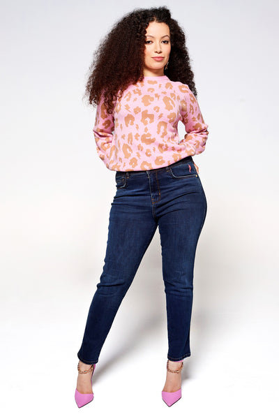 Scamp and Dude Dark Indigo Girlfriend Jeans | Model with long brown hair wearing dark skinny jeans and pink leopard print jumper with pink high heels