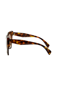 Tortoiseshell oversized sunglasses with Scamp & Dude text & lightning bolt logo on the arm in gold