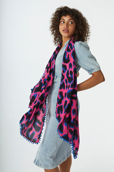 Scamp and Dude Khaki with Pink and Black Shadow Leopard Charity Super Scarf |  Model wearing a denim dress with leopard scarf around her neck