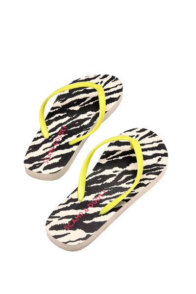 Scamp and Dude Ivory with Black Shadow Tiger Flip Flops | Product image of ivory with black shadow tiger flip flops on white background.