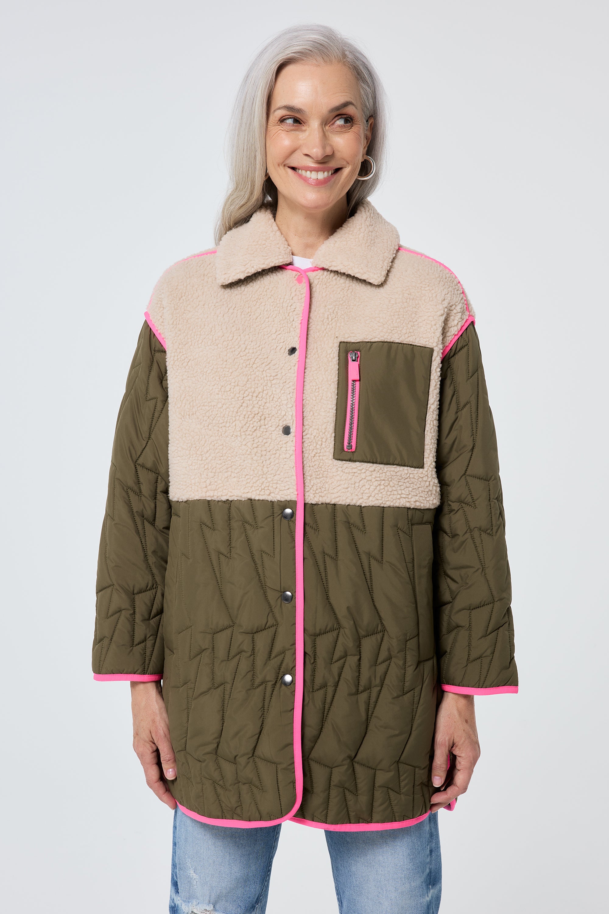 Scamp and Dude Quilted Khaki Lightning Bolt with Borg Coat | Model wearing khaki borg coat with leopard print sweatshirt and distressed jeans.