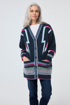 Scamp and Dude Navy with Rainbow Statement Bolt Longline Cardigan | Model wearing a navy longline cardigan featuring rainbow bolt detail.