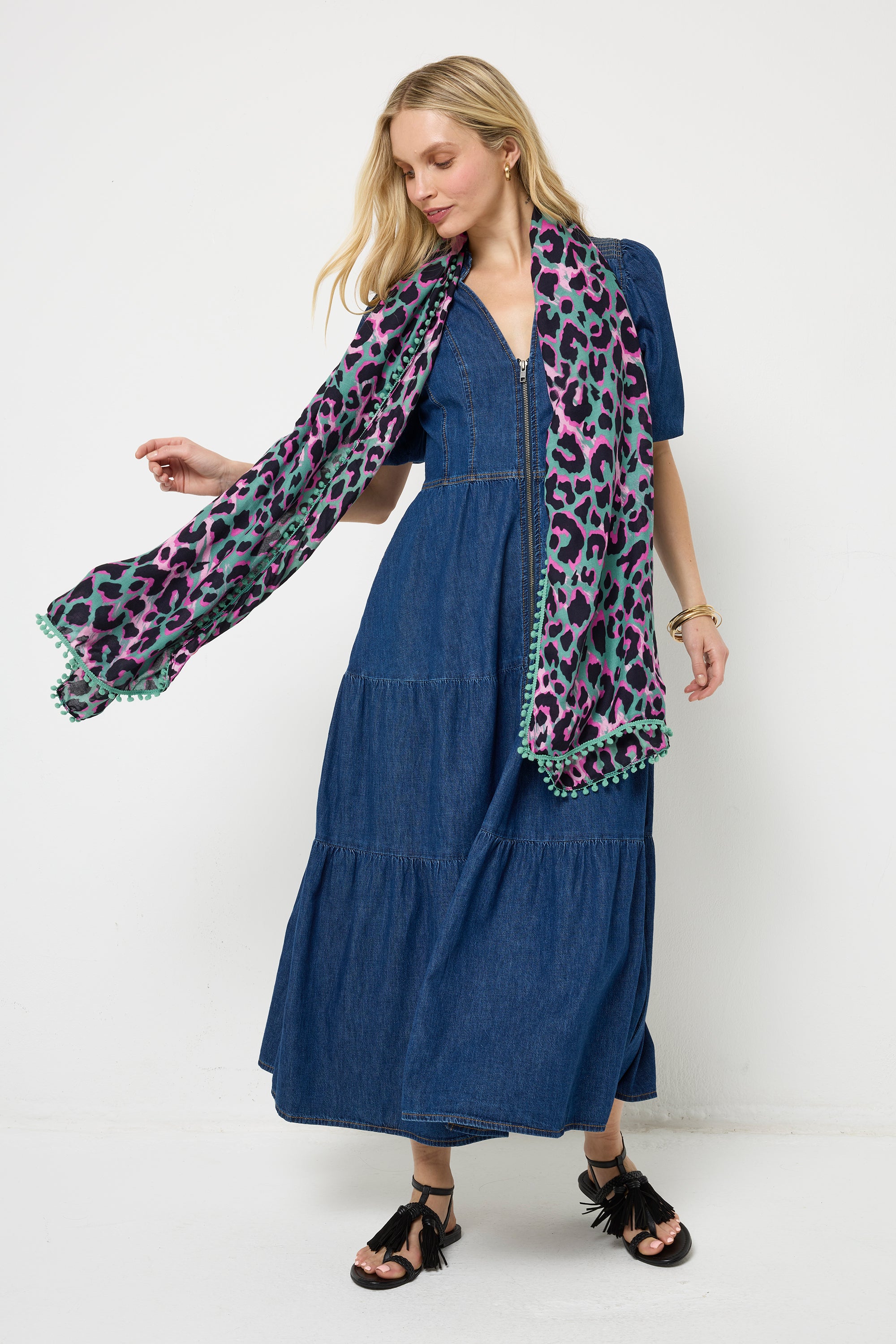 Scamp and Dude Khaki with Pink and Black Shadow Leopard Charity Super Scarf | Model wearing a dark blue denim midi dress with black sandals and a khaki, pink and black leopard print super scarf.