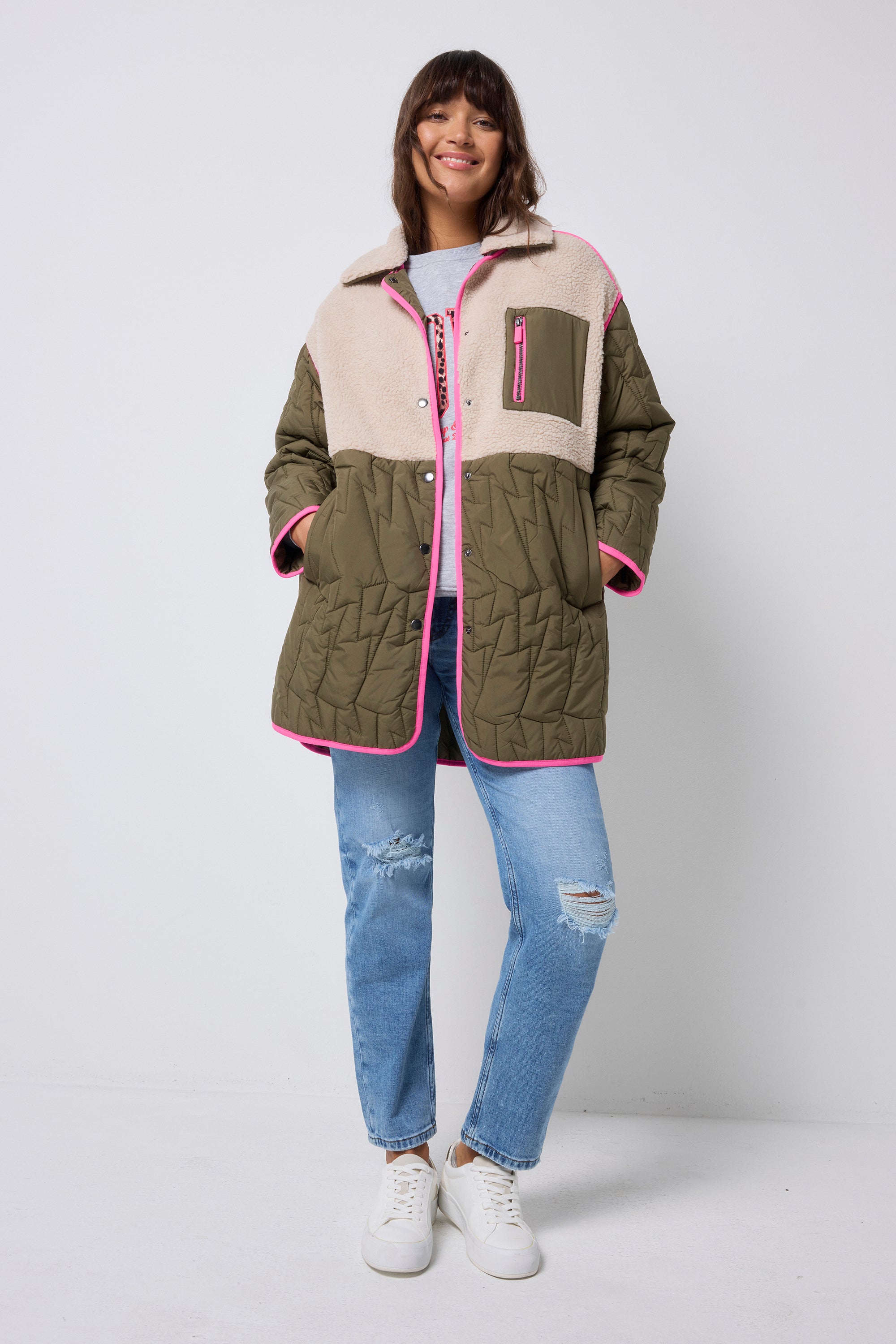 Scamp and Dude Quilted Khaki Lightning Bolt with Borg Coat | Model wearing khaki borg coat with grey love sweatshirt and distressed jeans.