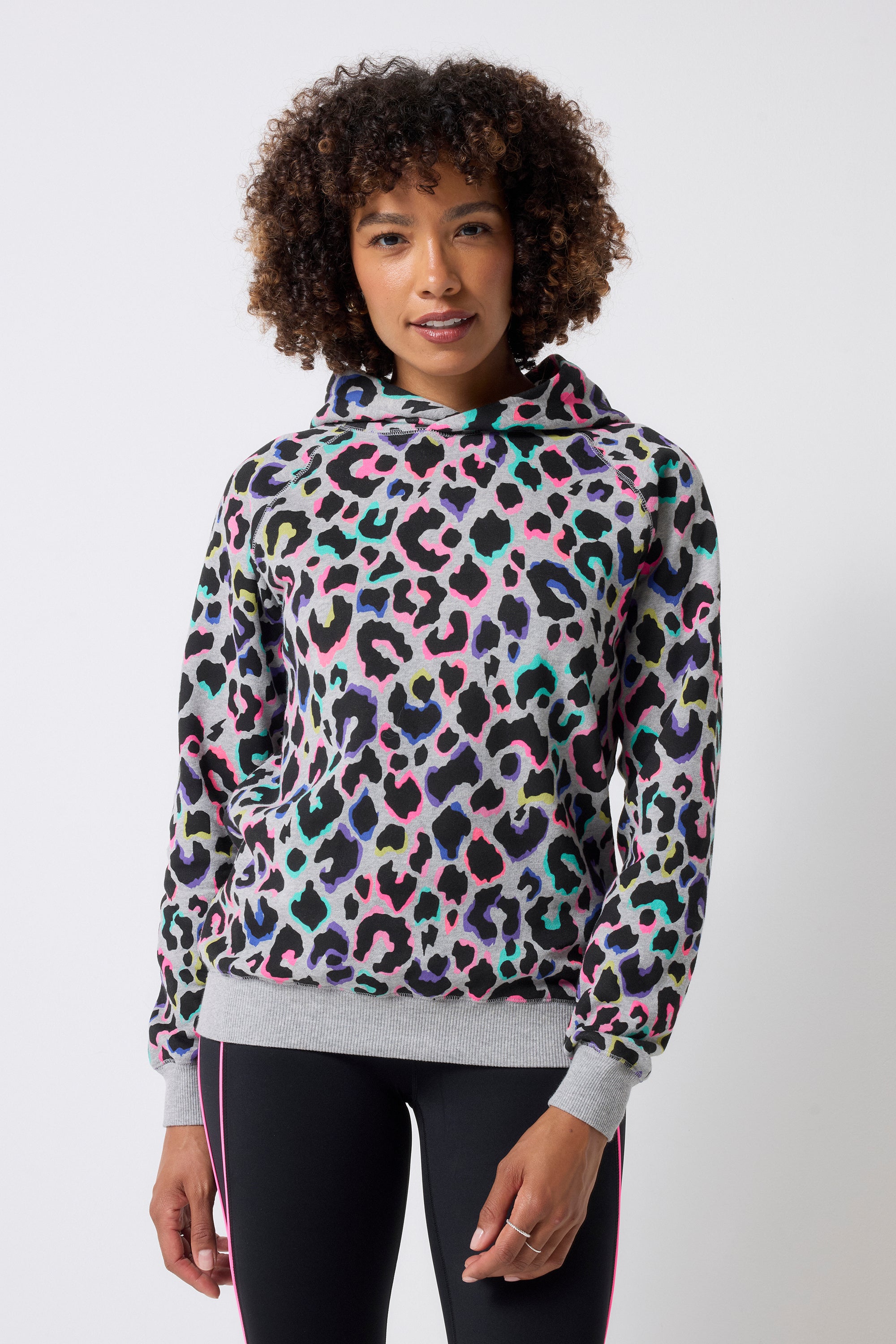 Scamp and Dude Light Grey with Rainbow Shadow Leopard Hoodie | Model wearing a light grey hoodie with rainbow shadow leopard print and black leggings.