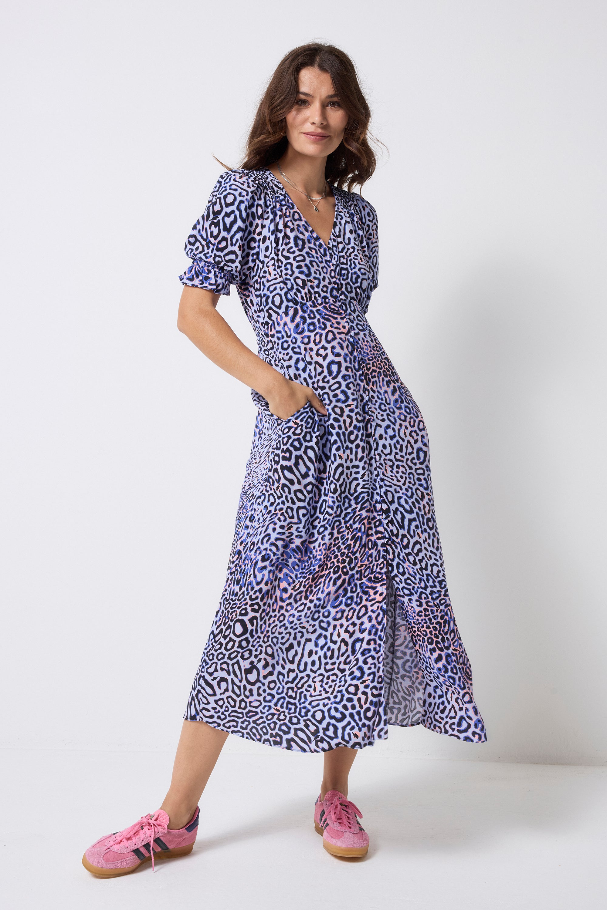 Scamp and Dude Lilac with Black and Pink Leopard Ray Flute Sleeve Midi Tea Dress | Model wearing a lilac short sleeve midi tea dress with black and pink leopard ray print. Worn with pink trainers.