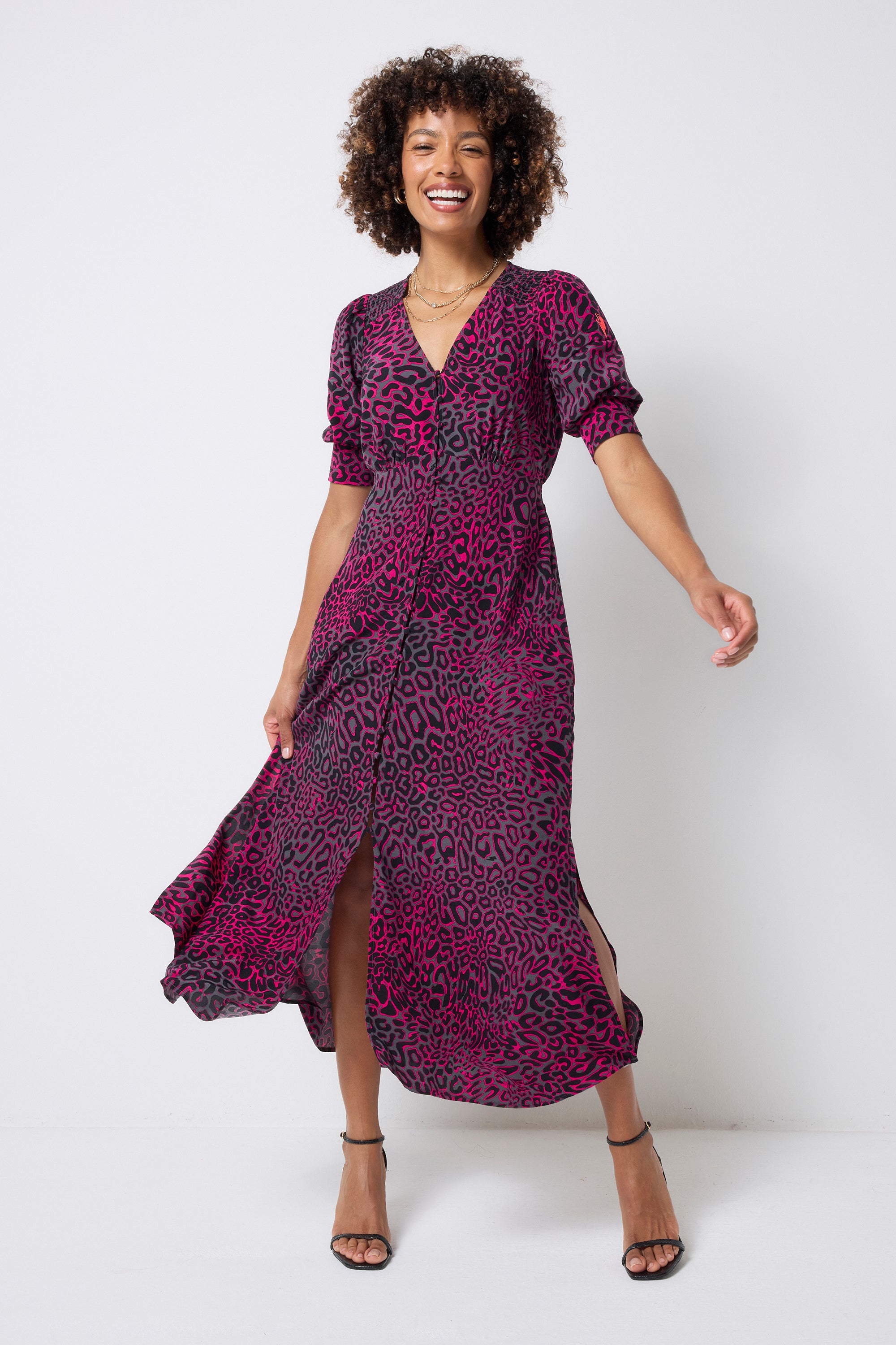 Scamp and Dude Grey with Pink Leopard Ray Blouson Sleeve Midi Tea Dress | Model wearing a grey short sleeve midi tea dress with pink leopard ray print and black strappy high heels.