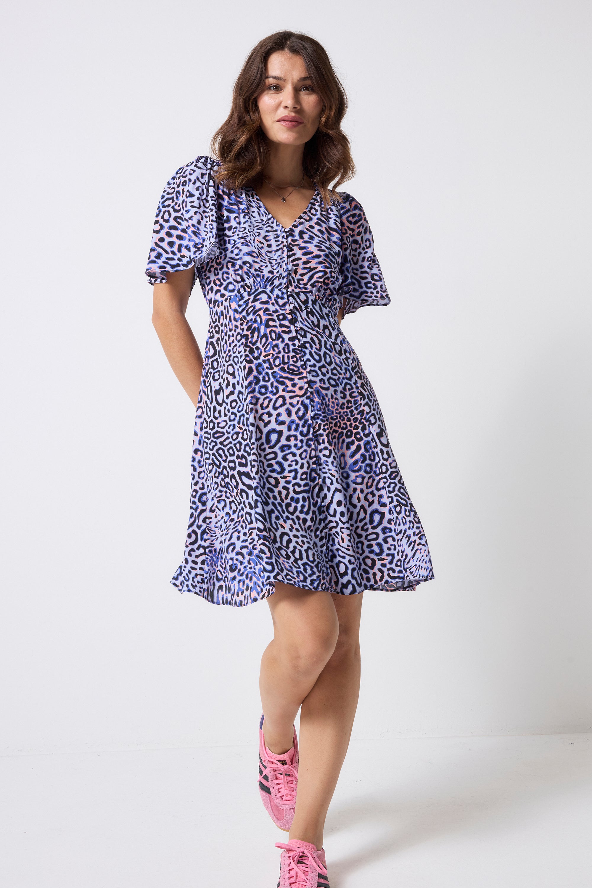 Scamp and Dude Lilac with Black and Pink Leopard Ray Angel Sleeve Short Tea Dress | Model wearing a lilac short sleeve mini tea dress with black and pink leopard ray print.