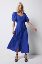 Scamp and Dude Blue Animal Jacquard Sweetheart Puff Sleeve Midi Tea Dress | Model wearing a blue jacquard animal dress with puff sleeves and button front details.