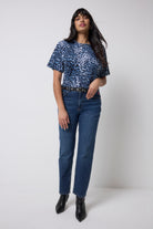 Scamp and Dude Navy with Black Cheetah T-Shirt | Model wearing a pair of dark blue jeans with a navy cheetah print t-shirt.