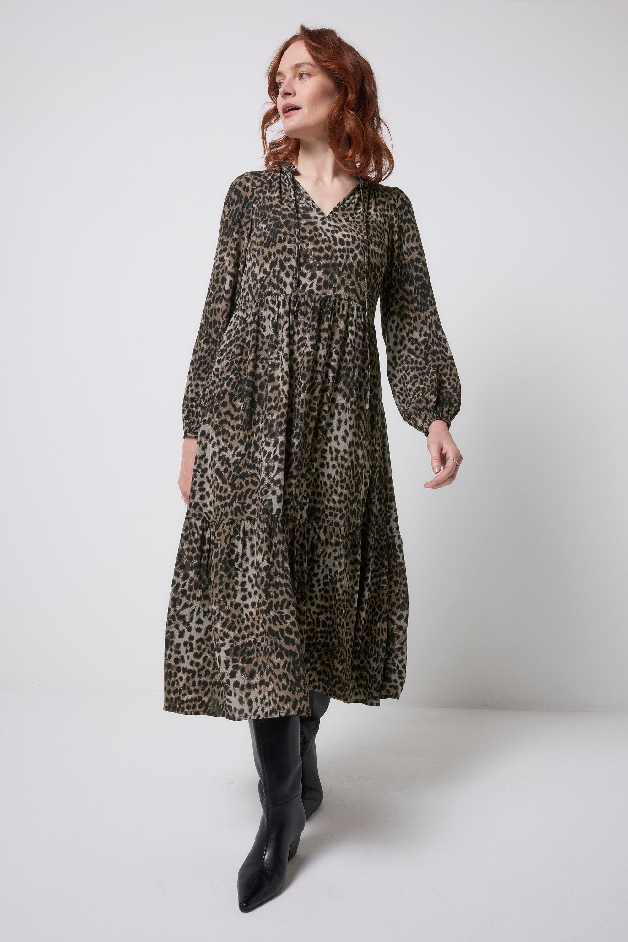 Scamp and Dude Khaki Cheetah Blouson Sleeve Tie Front Midi Dress | Model wearing a long sleeve khaki midi dress with tie front detail.