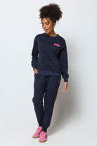 Scamp and Dude Navy with Black Leopard Ray Logo Oversized Sweatshirt | Model wearing a crew neck navy leopard ray print sweatshirt with matching joggers.