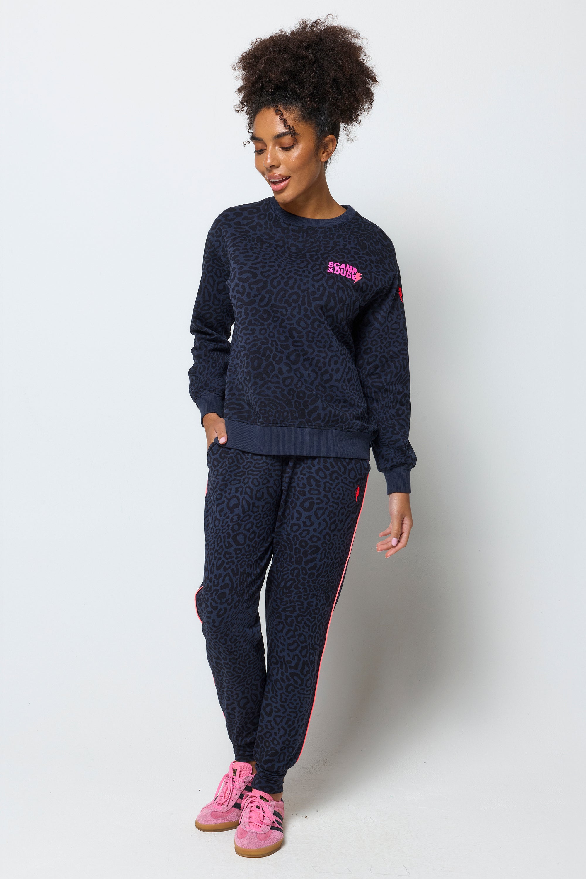 Scamp and Dude Navy with Black Leopard Ray Logo Oversized Sweatshirt | Model wearing a crew neck navy leopard ray print sweatshirt with matching joggers.