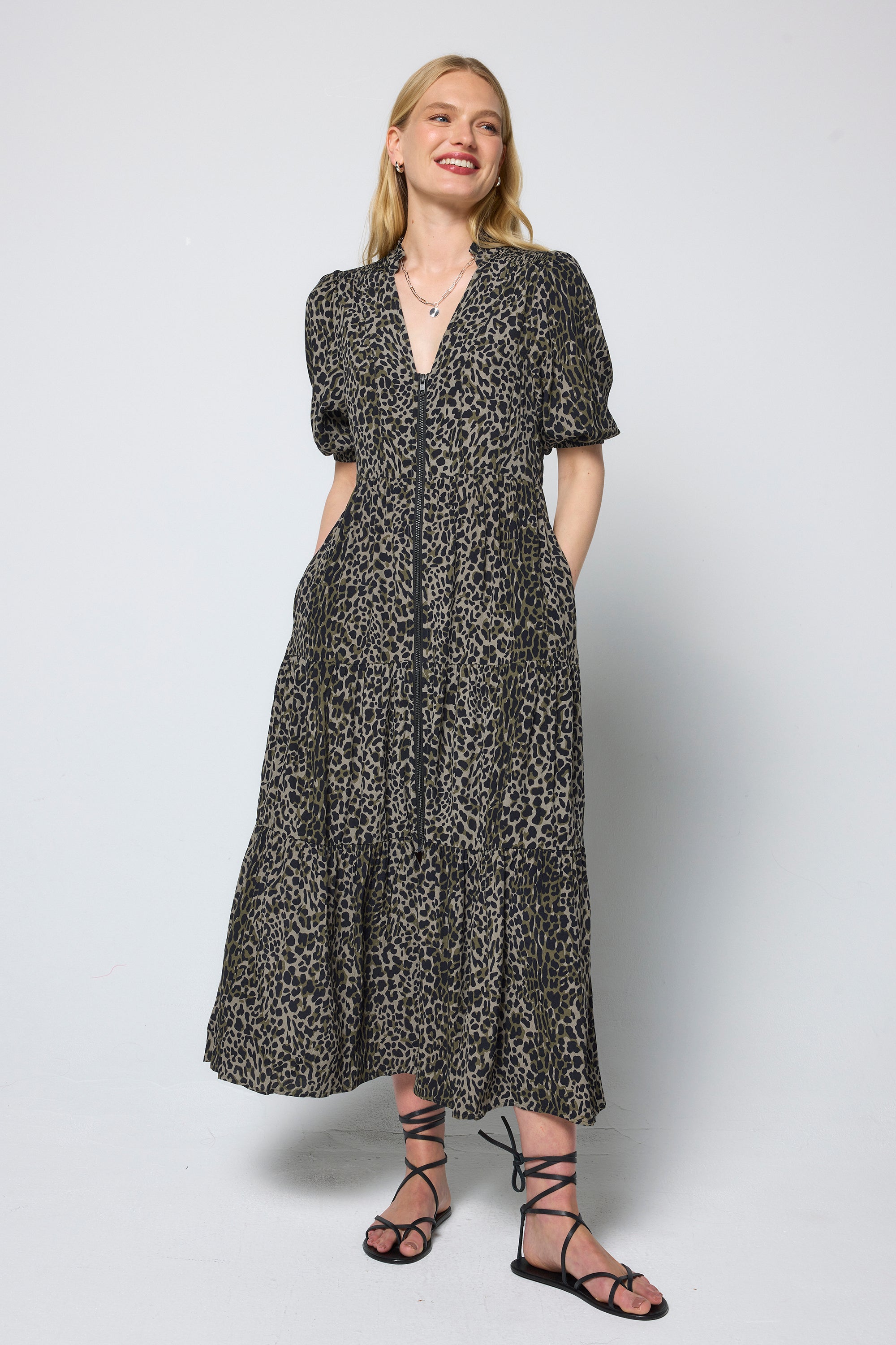 Scamp and Dude Khaki with Black Wild Leopard Zip Detail Tiered Midi Dress | Model wearing a short sleeve khaki zip front midi dress.