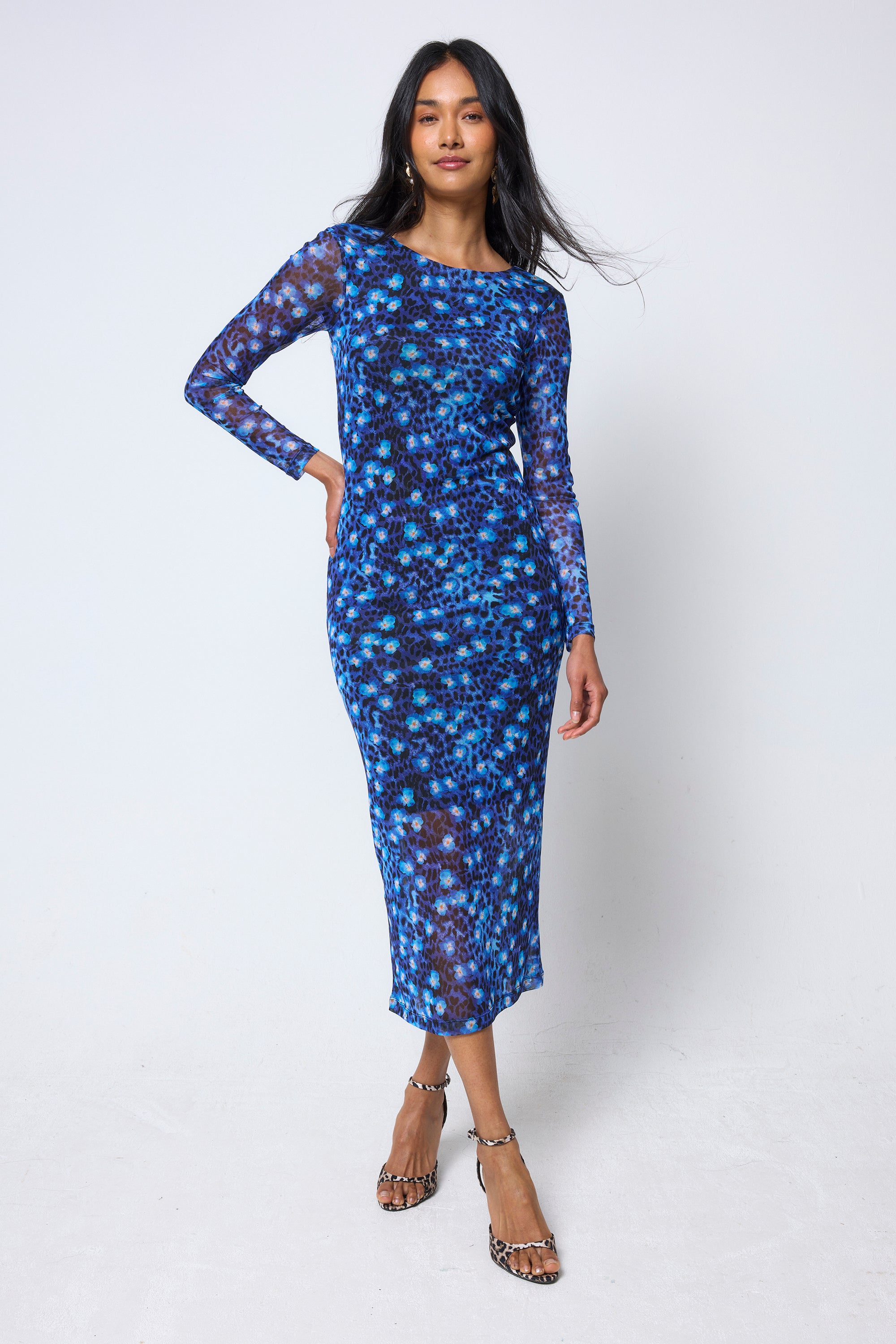 Scamp & Dude Navy Paradise Cheetah Mesh Midi Dress | Model wearing a navy paradise cheetah dress on a white background.