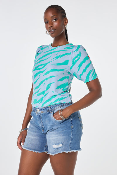 Scamp and Dude Light Blue with Green Graphic Tiger T-Shirt | Model wearing light blue round neck t-shirt with green graphic tiger print paired with washed indigo denim shorts.