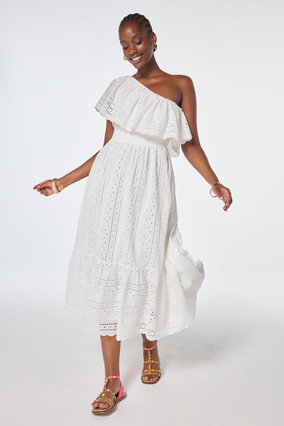 Scamp and Dude White One Shoulder Broderie Tiered Midi Dress | Model wearing one shoulder tiered midi dress with broderie detail paired with studded sandals.