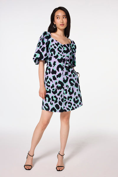 Scamp and Dude Lilac and Green with Black Mega Leopard Sweetheart Puff Sleeve Short Tea Dress | Model wearing a lilac and green with black mega leopard short puff sleeve tea dress with a sweetheart neckline and mega leopard print.