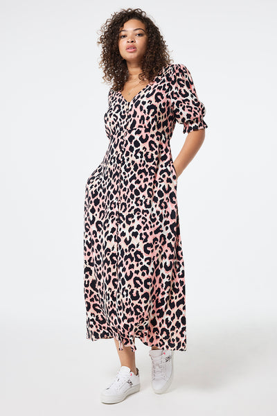 Scamp and Dude Mixed Neutral with Black Shadow Leopard Flute Sleeve Midi Tea Dress | Model wearing a v-neck mixed neutral midi tea dress with black shadow leopard print and flute sleeves.