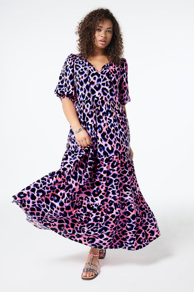 Scamp and Dude Pink with Blue and Black Shadow Leopard Tie Front Maxi Dress | Model wearing a short sleeve tie front maxi dress in pink with blue and black shadow leopard print.