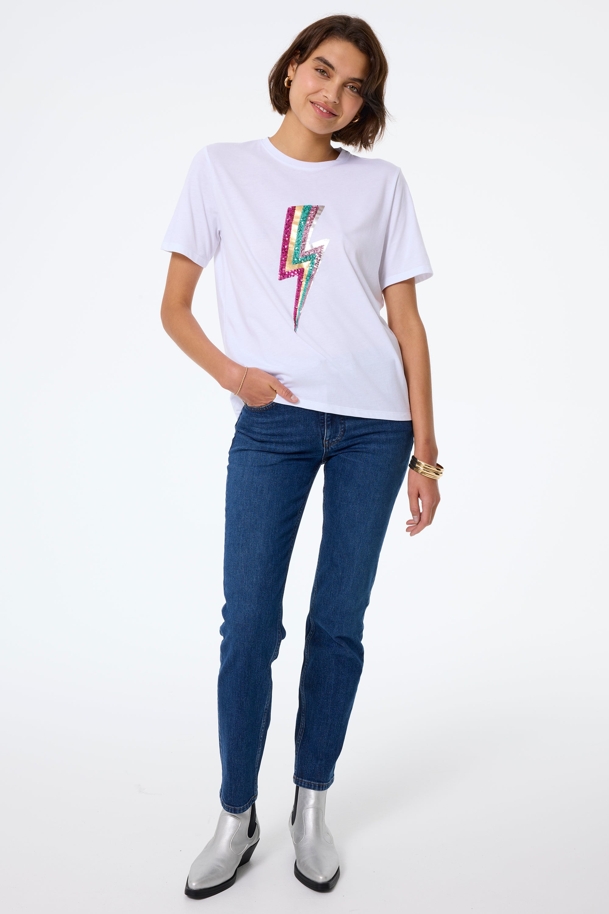 Scamp and Dude White with Multi Coloured Sequin and Foil Lightning Bolt T-Shirt | Model wearing indigo boyfriend jeans with a white t shirt featuring sequin foil bolt.