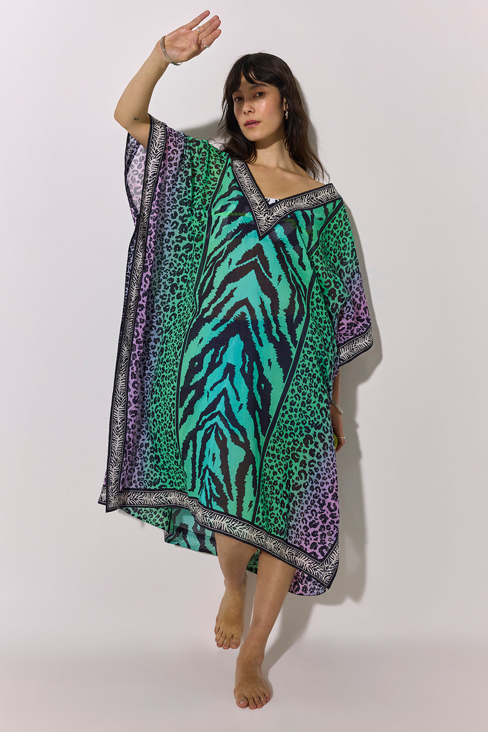 Scamp and Dude Green Ombre Mixed Animal Print Kaftan | Model wearing an ombre mixed animal print kaftan over a zebra print bikini.