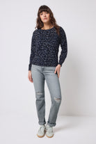 Scamp and Dude Navy Jaguar Printed Knit Jumper | Model wearing a navy printed knit jumper with a pair of grey washed jeans.