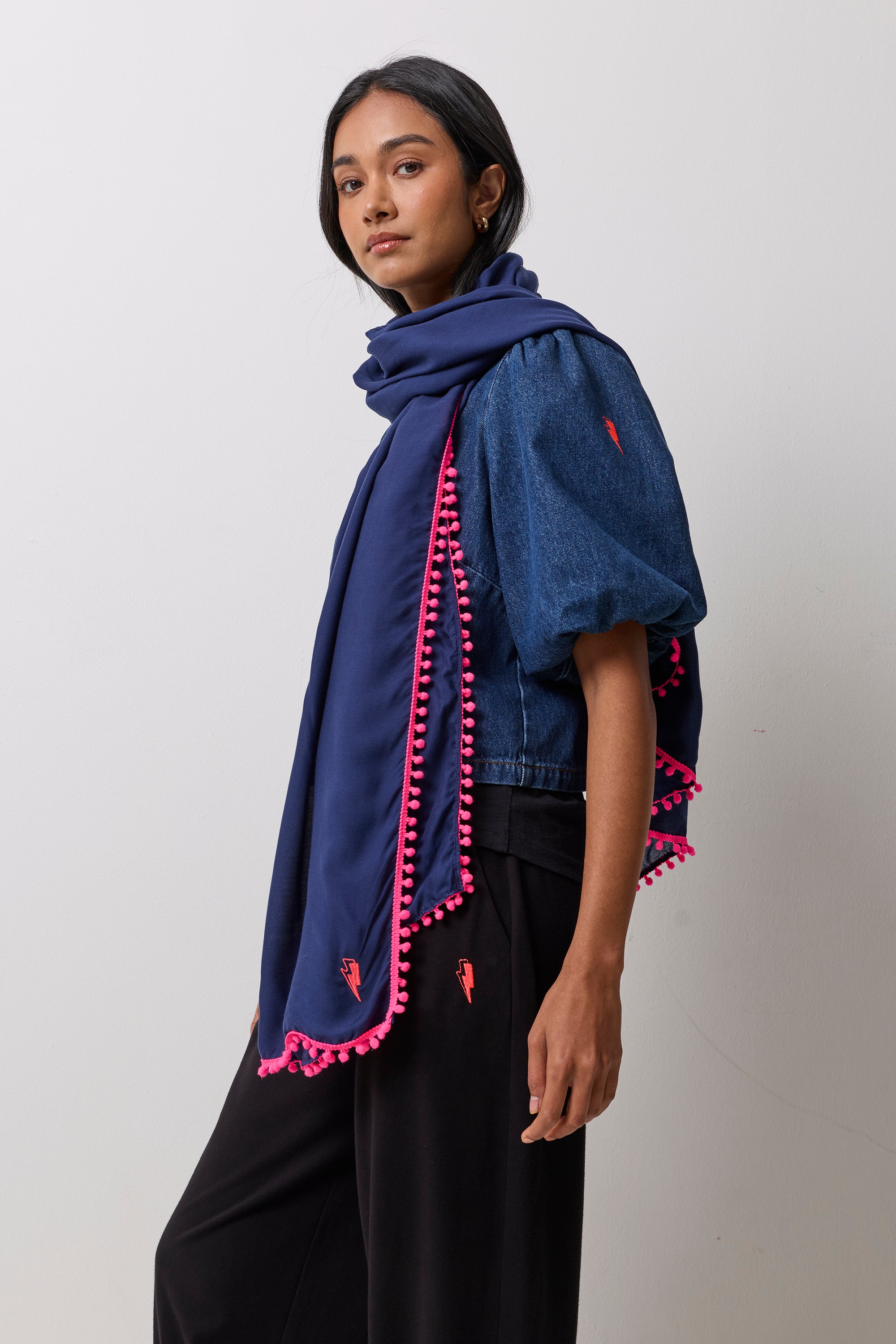 Scamp & Dude Navy Charity Super Scarf | Model wearing a denim top with black joggers and a navy super scarf.
