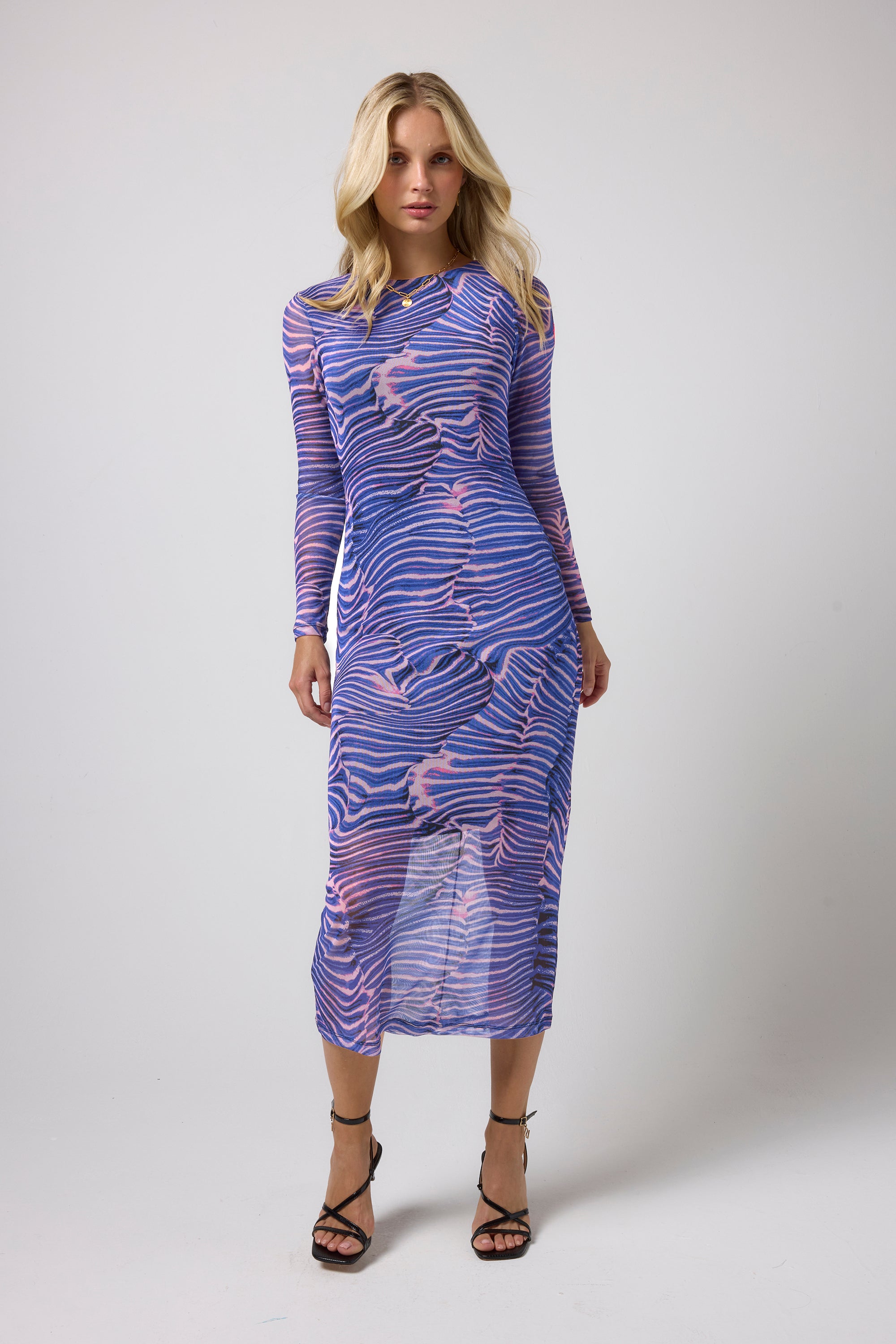 Scamp & Dude Blue Tiger Moth Mesh Midi Dress | Model wearing a mesh midi dress in a tiger moth print with black strappy heels.