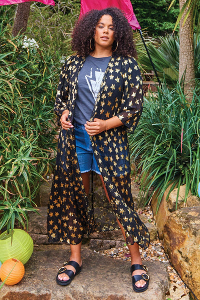 Scamp and Dude Black with Gold Jacquard Star Kimono | Model wearing black star print kimono with grey t-shirt and blue shorts