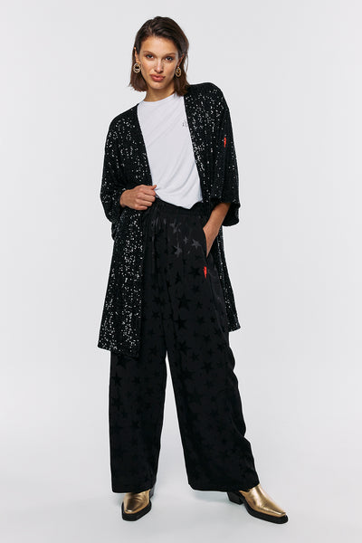 Scamp and Dude Black Sequin Kimono | Model wearing black sequin kimono with black star trousers and white t-shirt