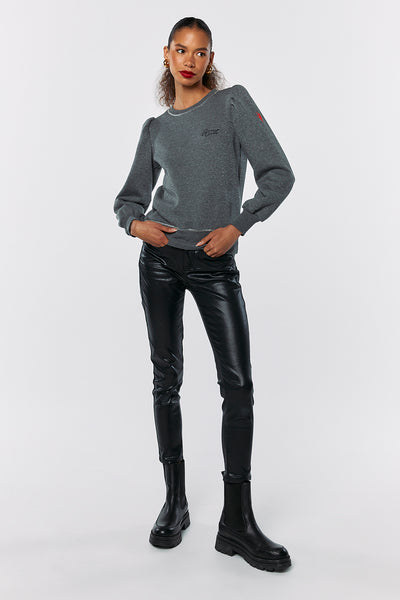 Scamp and Dude Grey Lurex Puff Sleeve Sweatshirt | Model posing with hands in pockets wearing a grey sweatshirt with leather trousers and black boots 