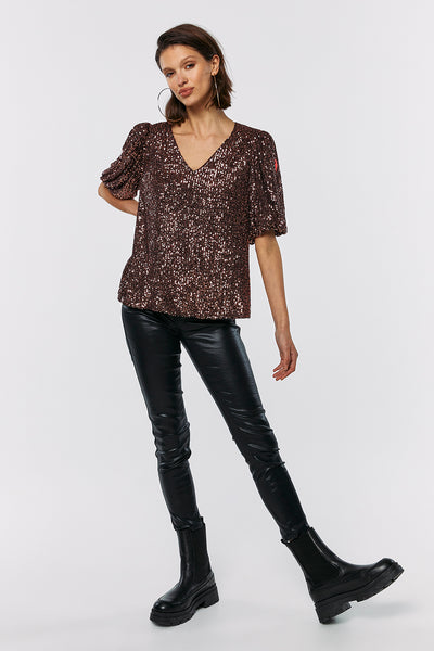 Scamp and Dude Rose Gold Puff Sleeve Sequin Top | Model wearing gold sequin top with black leather trousers and black boots