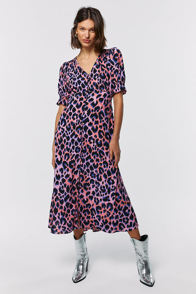 Scamp and Dude Pink with Blue and Black Shadow Leopard Button Through Midi Dress | Model wearing long pink dress with purple leopard print 