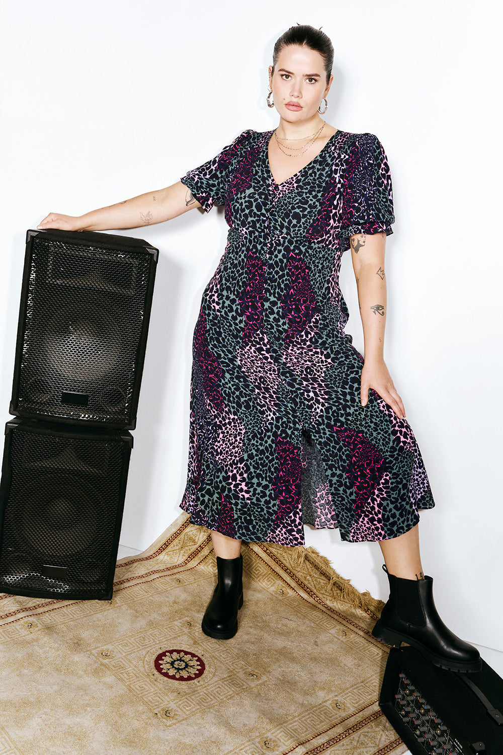 Scamp and Dude Khaki with Pink Spliced Leopard Flute Sleeve Midi Tea Dress | Model wearing v neck short sleeve tea dress in a spliced leopard print with button front placket, paired with black boots.