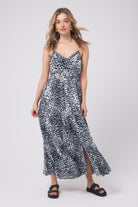 Scamp and Dude Grey with Black Cheetah Pintuck Midi Sundress | Model wearing a grey, white and black cheetah print sundress in a midi length with black studded sandals.