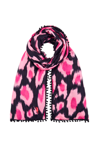 A black with hot pink and pink leopard ikat and lightning bolt print scarf with a black pom pom trim